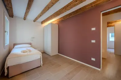 Letto o letti in una camera di La Cereria Design Flats - Il Ceramista