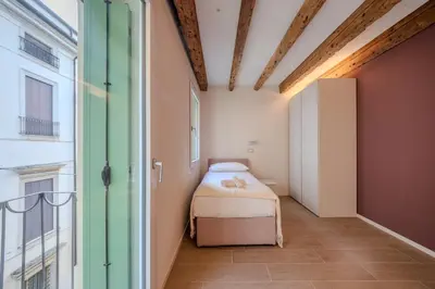 Letto o letti in una camera di La Cereria Design Flats - Il Ceramista