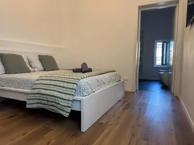 Letto o letti in una camera di Vittoria Venice Home
