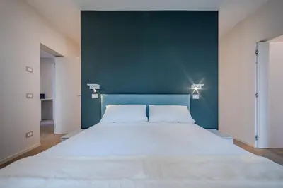 Letto o letti in una camera di The Cereria Design Flats - L' Incisore