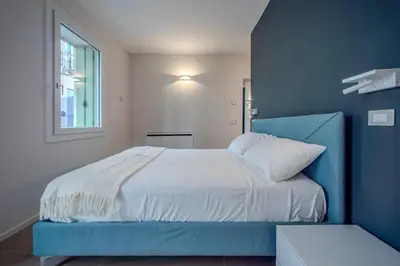 Letto o letti in una camera di The Cereria Design Flats - L' Incisore