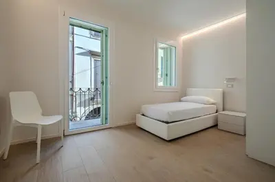 Letto o letti in una camera di La Cereria Design Flats - Il Cesellatore