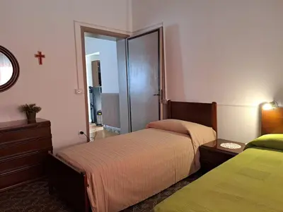 Letto o letti in una camera di a casa di nonna Tarsilla-entire apartment,5 guests