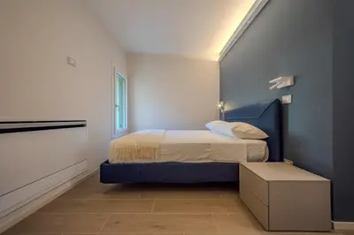 Letto o letti in una camera di La Cereria Design Flats - L' Alchimista