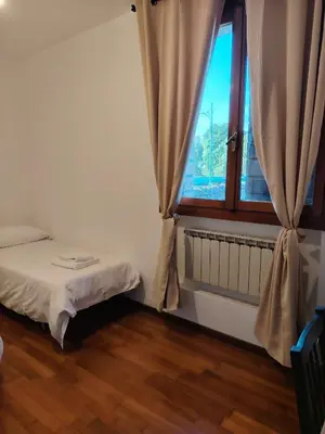Letto o letti in una camera di Villa Bazzera