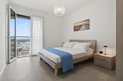 Letto o letti in una camera di Villa Laila IRIS SUITE APARTMENTS