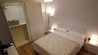 Letto o letti in una camera di enJoy Home - Bilocale in centro, in Corso Milano