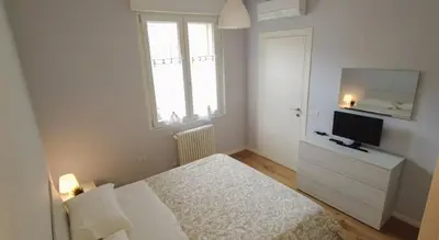 Letto o letti in una camera di enJoy Home - Bilocale in centro, in Corso Milano