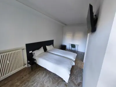Letto o letti in una camera di Grace House