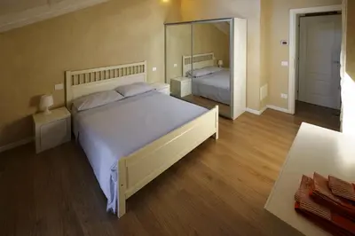 Letto o letti in una camera di Chez Alberto