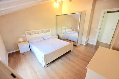 Letto o letti in una camera di Chez Alberto