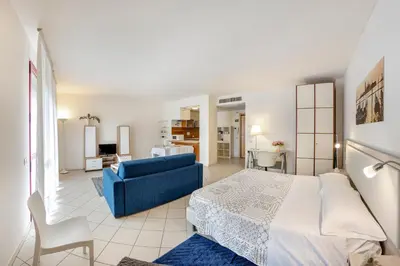 Letto o letti in una camera di Venice Lion Apartments, Comodi per Venezia e Jesolo