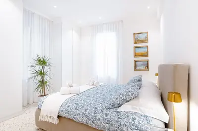 Letto o letti in una camera di Dimora elegante con esclusivo giardino privato