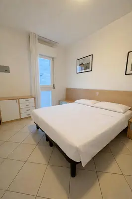 Letto o letti in una camera di BlueWave Jesolo