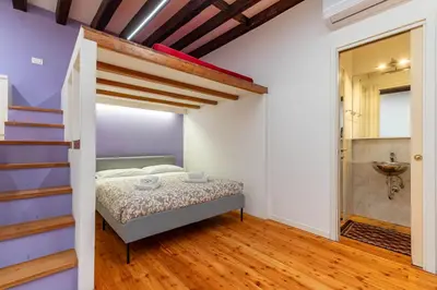 Letto o letti in una camera di Ca' Renaissance