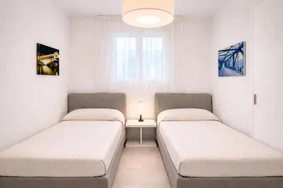 Letto o letti in una camera di Les Maisons - Carraro Immobiliare - Family Apartments