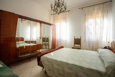 Letto o letti in una camera di Dimora Magnolia - Isola di Pellestrina VE