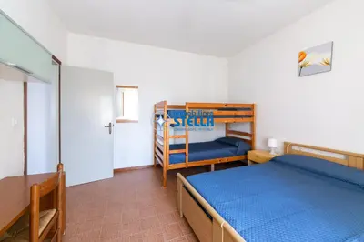 Letto o letti in una camera di Condominio Romeo