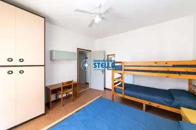 Letto o letti in una camera di Condominio Romeo