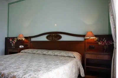 Letto o letti in una camera di Hotel Bracco