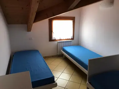 Letto o letti in una camera di Residence Solmare Quadrilocale