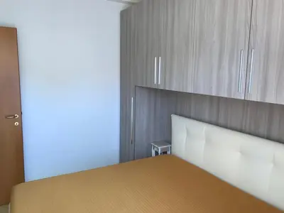 Letto o letti in una camera di Residence Solmare Quadrilocale