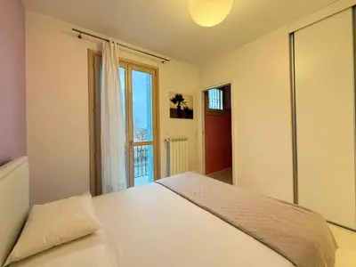 Letto o letti in una camera di BORGO DEI FIORI - Solo per Famiglie-Walterigato Apartments
