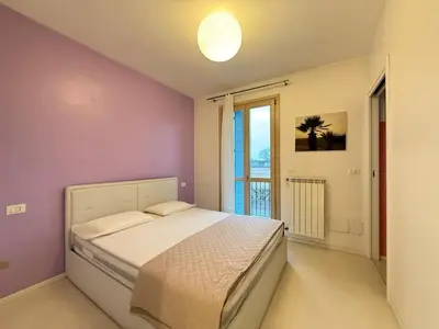 Letto o letti in una camera di BORGO DEI FIORI - Solo per Famiglie-Walterigato Apartments