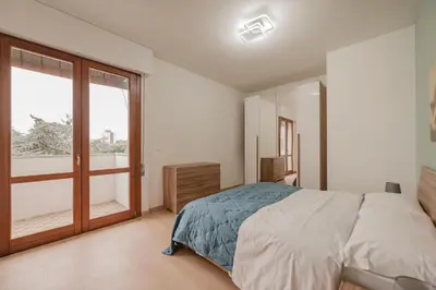 Letto o letti in una camera di Vittoria's Flat - 15 min da Venezia & Parcheggio