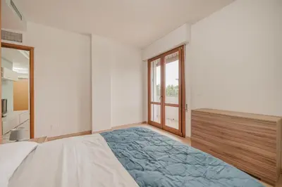 Letto o letti in una camera di Vittoria's Flat - 15 min da Venezia & Parcheggio