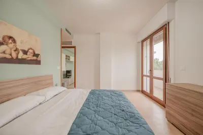 Letto o letti in una camera di Vittoria's Flat - 15 min da Venezia & Parcheggio