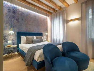Letto o letti in una camera di Palazzo Sarti Apartments R&R