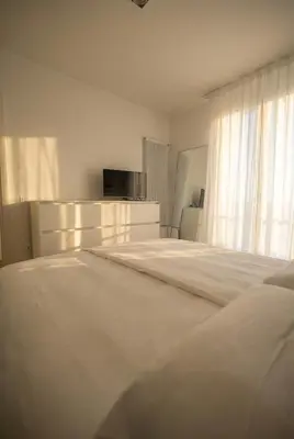 Letto o letti in una camera di Novo Living Jesolo