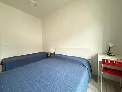 Letto o letti in una camera di VILLA GIULIA- Solo per Famiglie- WALTERIGATO APARTMENTS