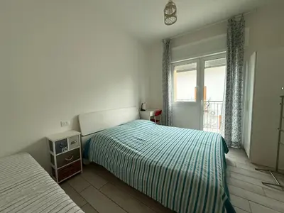 Letto o letti in una camera di VILLA GIULIA- Solo per Famiglie- WALTERIGATO APARTMENTS