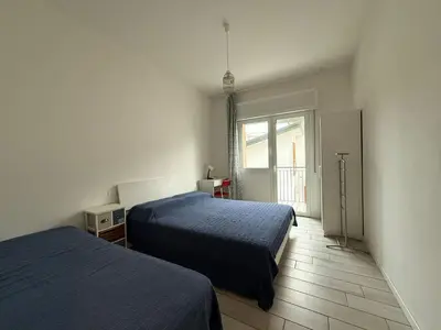 Letto o letti in una camera di VILLA GIULIA- Solo per Famiglie- WALTERIGATO APARTMENTS