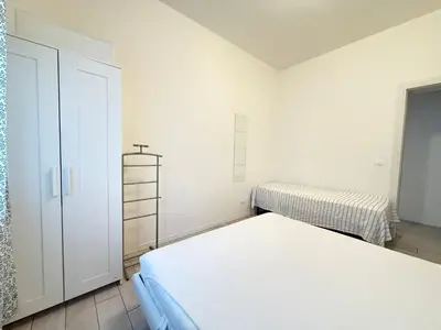 Letto o letti in una camera di VILLA GIULIA- Solo per Famiglie- WALTERIGATO APARTMENTS