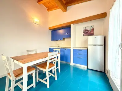 Cucina o angolo cottura di Villaggio dei Gabbiani - Carraro Immobiliare - Family Apartments