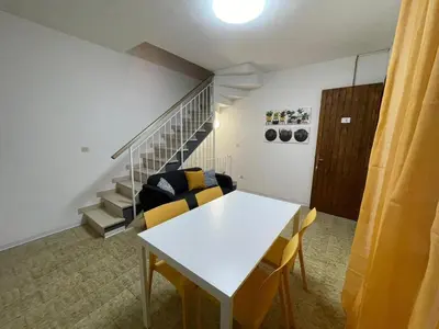Area soggiorno di Rosolina Holiday Home in the Mediterranean