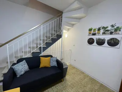 Area soggiorno di Rosolina Holiday Home in the Mediterranean