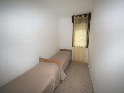 Letto o letti in una camera di Holiday Apartment in Rosolina Mare