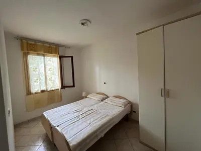 Letto o letti in una camera di Flexible 6-Person Stay in Rosolina Mare