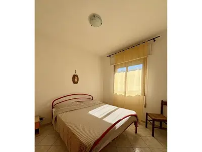 Letto o letti in una camera di Small apartment house with balcony