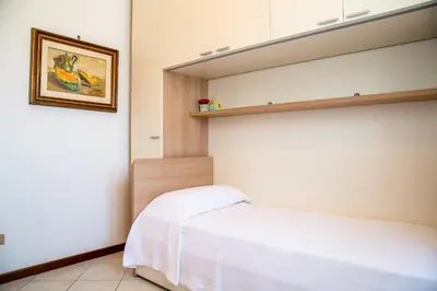 Letto o letti in una camera di Appartamento Vittoria - Catene Marghera