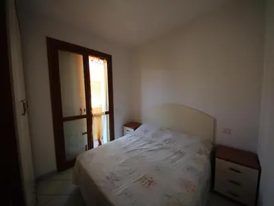 Letto o letti in una camera di Family stay in Rosolina for six guests