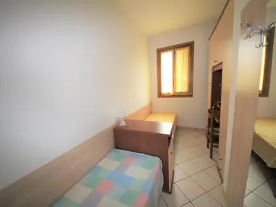 Letto o letti in una camera di Family stay in Rosolina for six guests