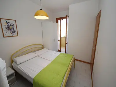 Letto o letti in una camera di Seaside retreat near Rosolina Mare beach
