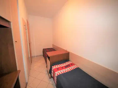 Letto o letti in una camera di Family stay in Rosolina Mare near sea