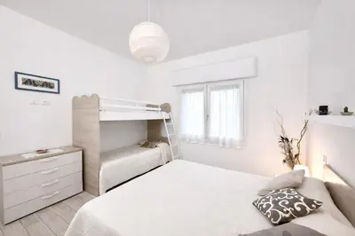 Letto o letti in una camera di Villa Nadia - Carraro Immobiliare - Family Apartments