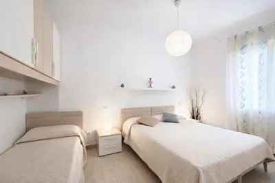 Letto o letti in una camera di Villa Nadia - Carraro Immobiliare - Family Apartments
